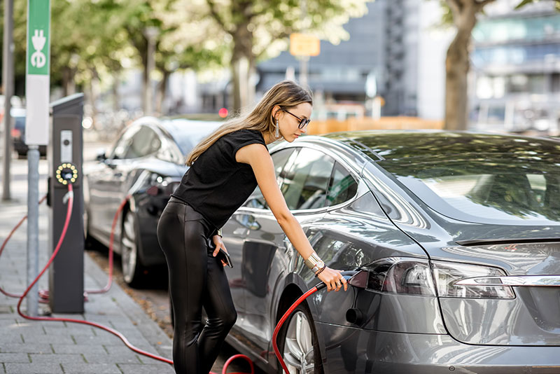 Image of woman getting into car